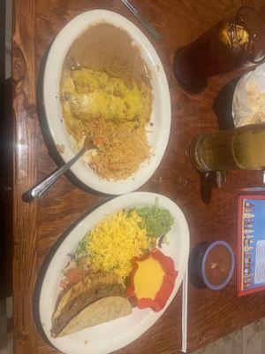 Cheese enchiladas, rice, beans, taco and cheese sauce