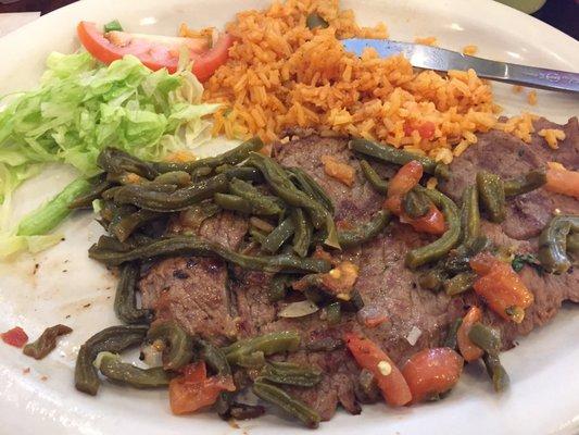 Carne Asada with just rice. No sear nor had it been trimmed. The "Avocado Slices" depicted in the picture is actually just guacamole.