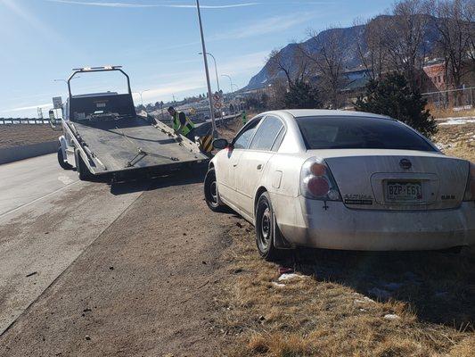 Walt's Towing helping me out, on an I-25 on-ramp.