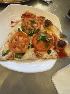 Margarita pizza slice