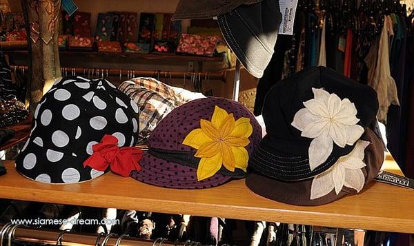 A small collection of hats. Generally there are more available during the fall and winter months.