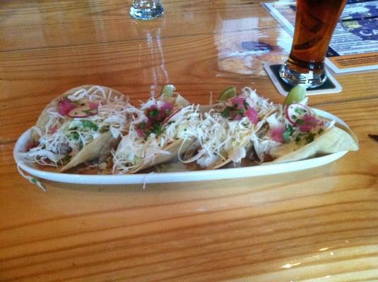 Taquitos Mar de Cortez: 4 corn tortillas stuffed with beer battered fish with chipotle dressing, cabbage, and cilantro.