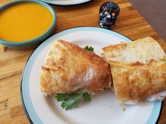 Butternut squash soup and turkey sandwich on homemade ciabatta bread.