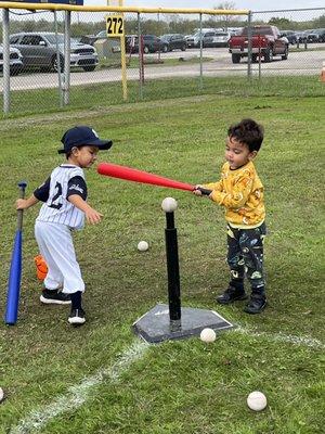 my boy teaching his cousin