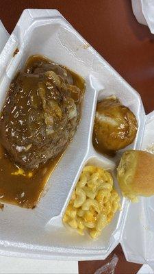 Hamburger Steak plate with onions, mashed potatoes, macaroni and cheese and a dinner roll!