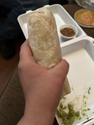 The burrito is the size of of my hand and very skinny