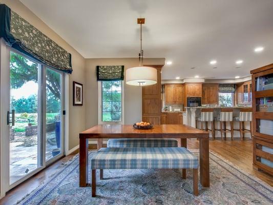 Informal eating area remodel with new custom window treatments, lighting, and furnishings