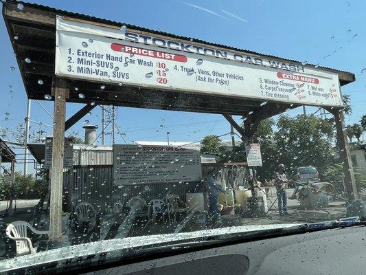 Car wash area. Pull up and sit in the car while they wash.