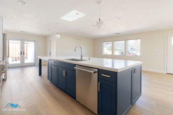 Perfect for entertaining! Top Remodeling & Design created this beautiful kitchen with custom cabinetry and elegant lighting.