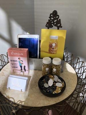 Cute table between the two chairs in the waiting area.