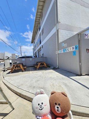 Outdoor seating on the corner of Mokauea Street and Hau Street