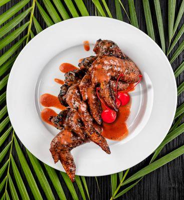 Whole chicken wings fried naked and crispy, tossed in a tangy, full bodied cherry citrus BBQ sauce.  Hand crafted and chef inspired