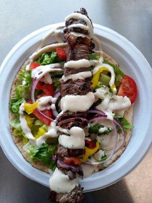 "Bulldozer" Sirloin Beef Kabob in Pita, with salad and Tahini Sauce.