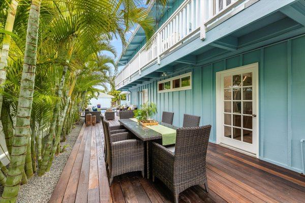 The Rectangular Dining Set in our Brown wicker and Light gray cushions in Kailua, HI.