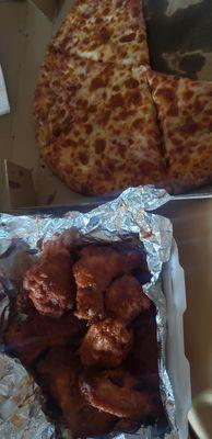 Pepperoni pizza with extra cheese and spicy wings