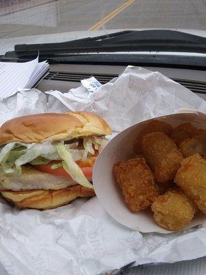 Grilled chicken sandwich with tator tots and large drink