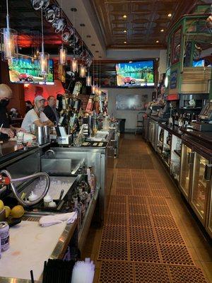 bar area with lots of TVs for sports