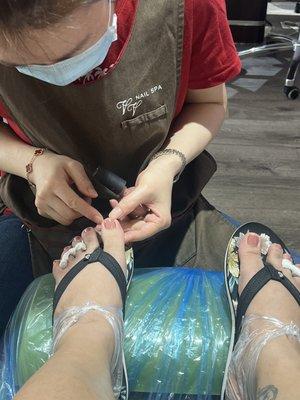 At the end of spa pedicure (parafin heel treatment)