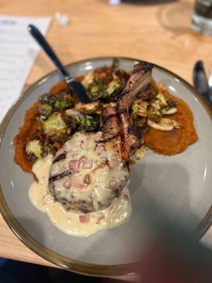 Pork chop with roasted Brussels sprouts & mashed sweet potatoes. Cooked perfectly not over sauced