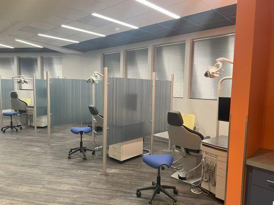 Privacy walls between clinic chairs and seating for parents