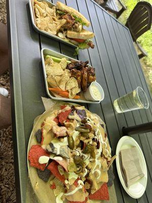 Nachos, chicken wings, and BLT sandwich