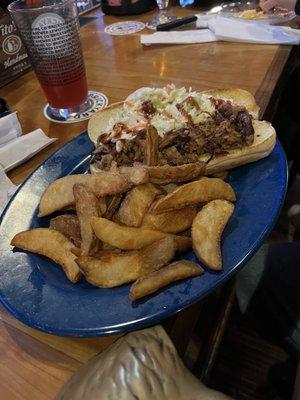 Pork sandwich or po' boy and really good French fries