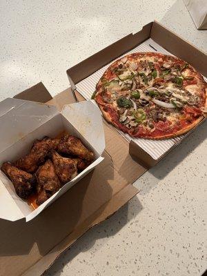 Umberto ultra thin crust pizza and buffalo wings.