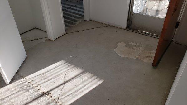 Entry way after Fresh Air removed the tiles and black mastic.  No more asbestos!