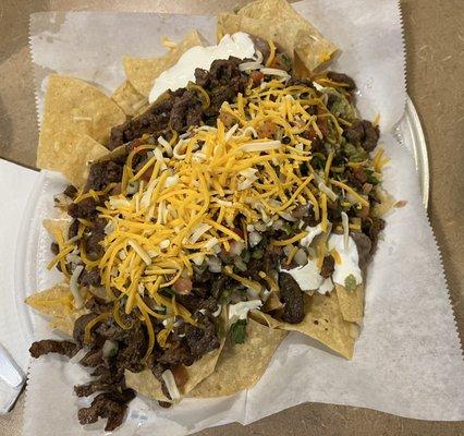 Super nachos with carne asada