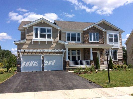 Siding, stone, trellises, cornice,