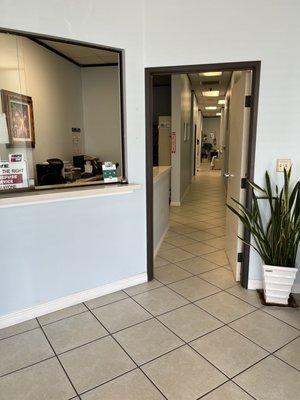 Front desk and hallway to treatment stalls