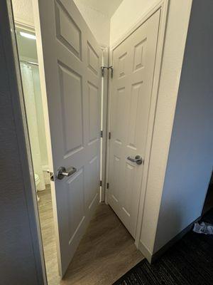 awkward placement doors to bathroom and closet in a newly remodeled room