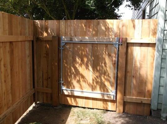 After: New wood on Existing Steel posts and Cleaned up Steel gate frame.