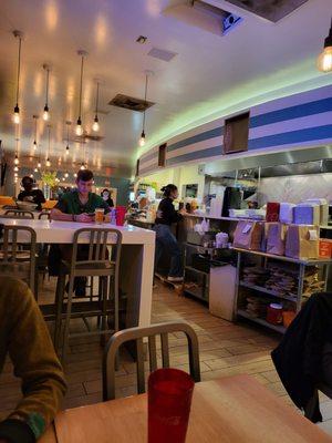 View of kitchen and another section of the indoor dining area.