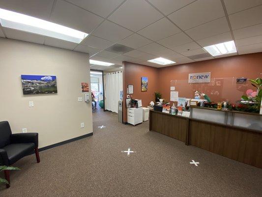 Front desk and waiting room. Precautions are always taken for safety of our patients.