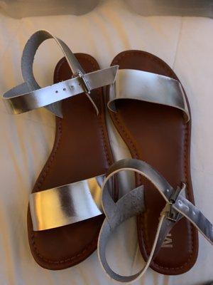 Silver strap on sandals.