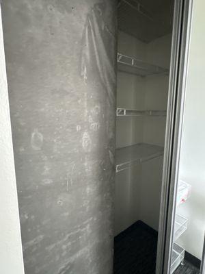 Big cement in the closet. With little room for clothes.