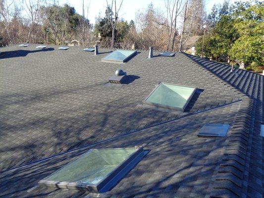 GAF Timberline HD Shingles in Charcoal with Velux Deck Mounted Skylights and O'hagin Attic Vents