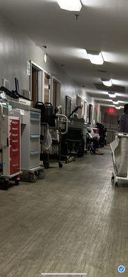 The cluttered hallway outside my room