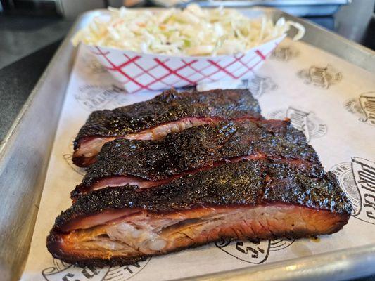 Coleslaw and ribs. Enjoyed with a different sauce on each rib. Always delicious!