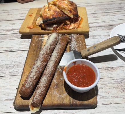 Thunder sticks and chicken parm sandwich on garlic bread