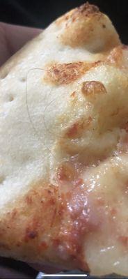 Hair in the pizza.