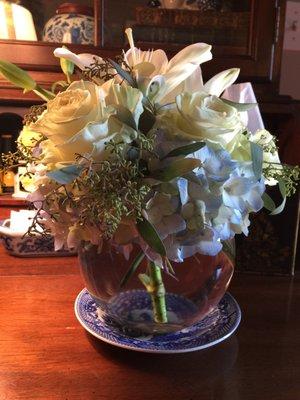 Beautiful  Lillys, roses, and hydrangea.