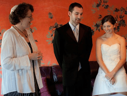 signing the ketubah, the document that contains the couples' wedding promises