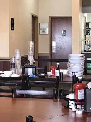 A dining table full off dirty dishes, for my entire visit.