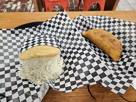 Arepa with cheese and pabellon empanada