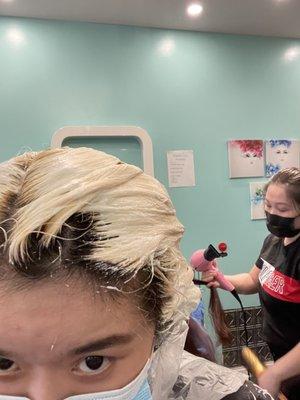 Initial bleach session, see how the roots were unevenly done with coarse lines.