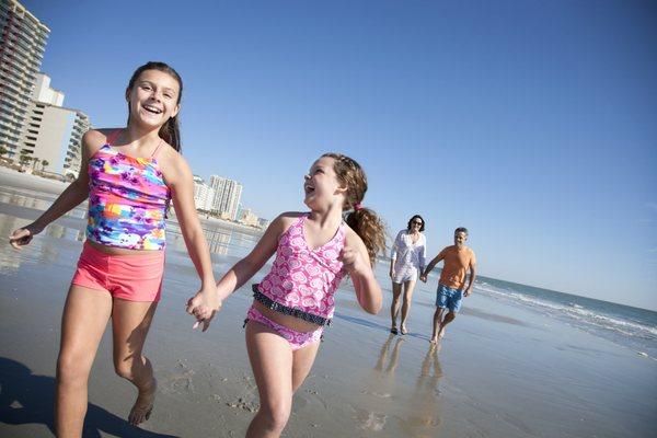 Girls running on beach