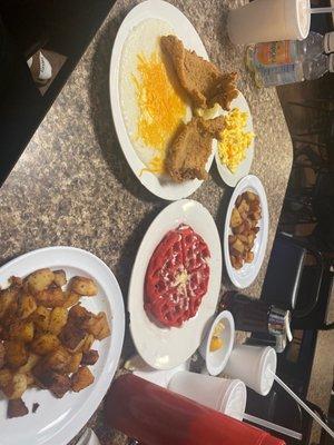 Catfish and grits with potatoes and red velvet Belgian waffle