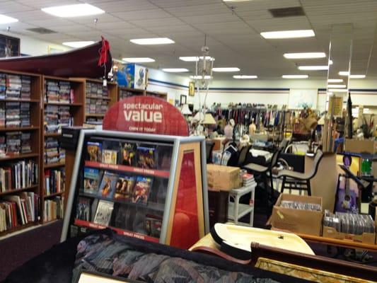 Large area for CDs/DVDs on the left - it goes back for several aisles. Notice both a skeleton & a canoe for sale in one place!